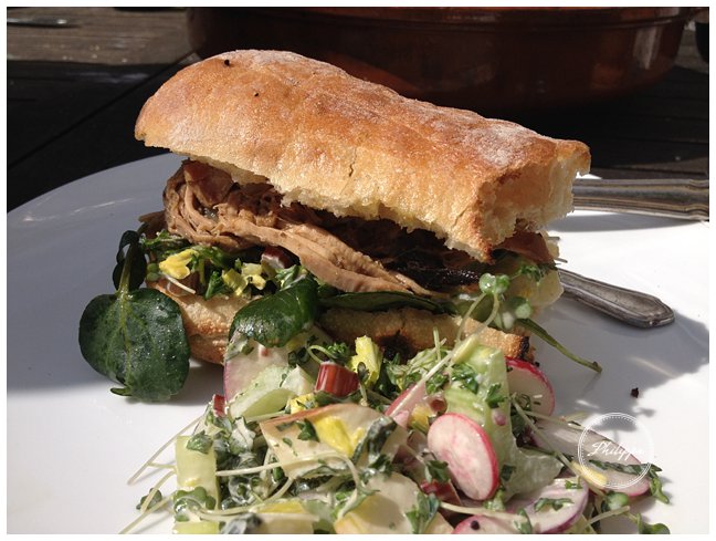 Slow roast shoulder of pork sandwich with rhubarb and radish salad